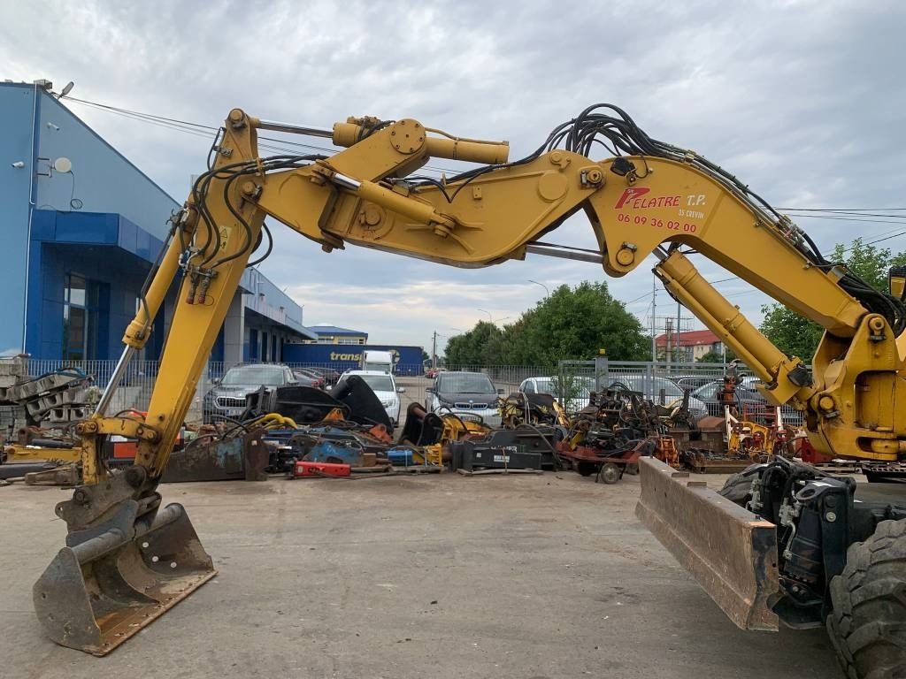 2018 Komatsu PW118MR-11W wheel excavator side view