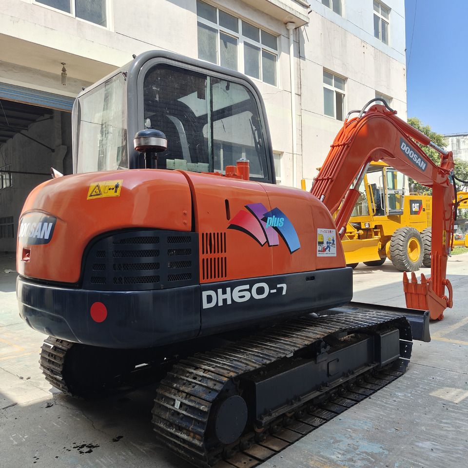 Doosan DH60-7 mini excavator, rear three-quarter view Doosan DH60-7 mini excavator, rear three-quarter view
