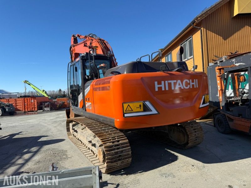 2022 Hitachi ZX210LC-7 crawler excavator, rear three-quarter view 2022 Hitachi ZX210LC-7 crawler excavator, rear three-quarter view