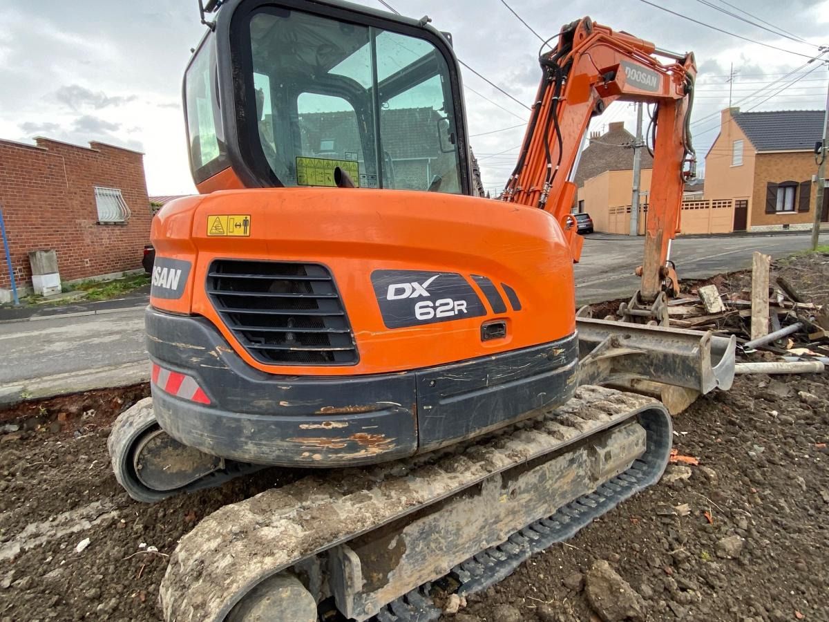 2018 Doosan DX62R-3 mini excavator, rear three-quarter view 2018 Doosan DX62R-3 mini excavator, rear three-quarter view