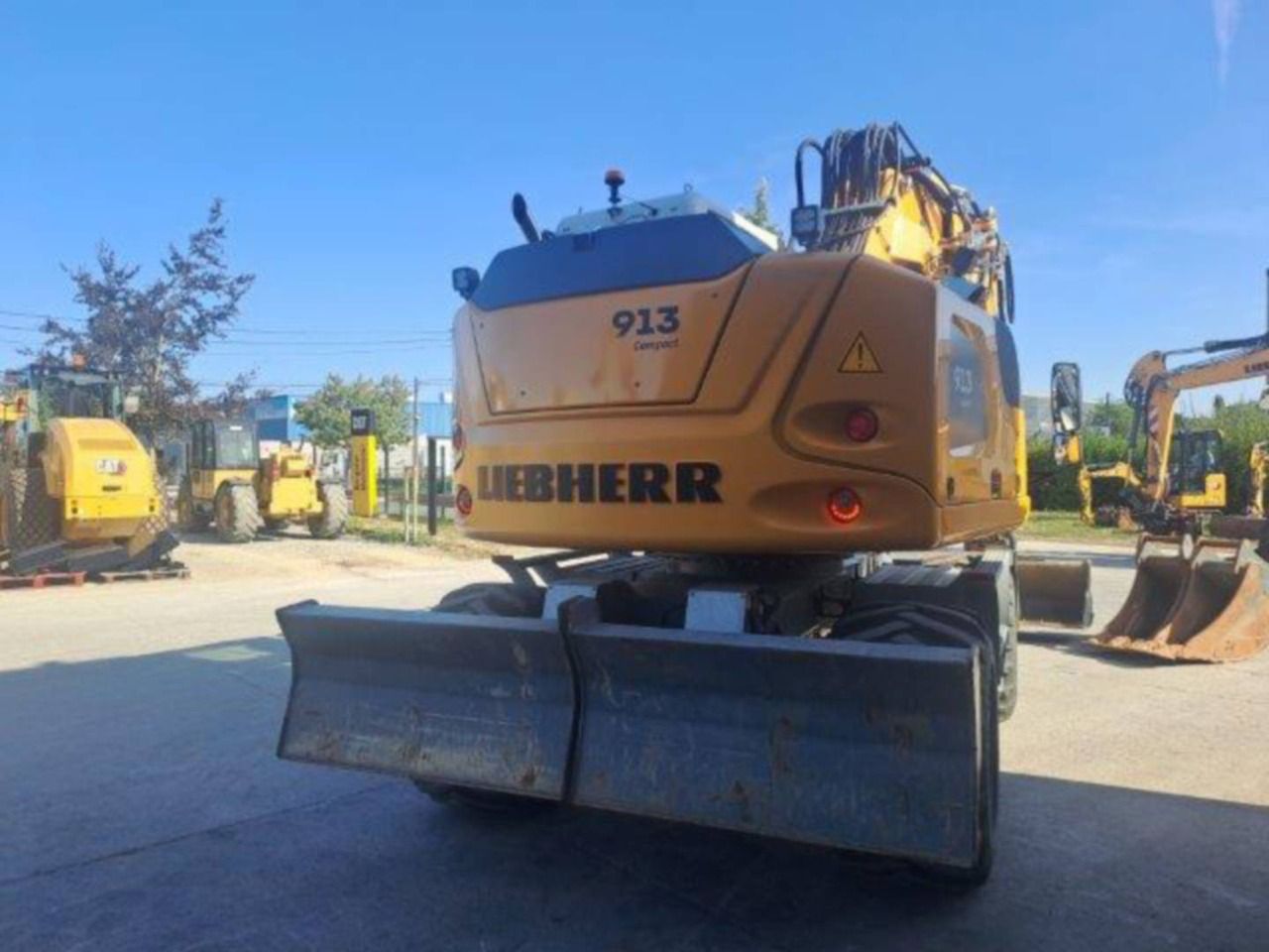 2023 Liebherr A 913 Compact wheel excavator, rear view 2023 Liebherr A 913 Compact wheel excavator, rear view