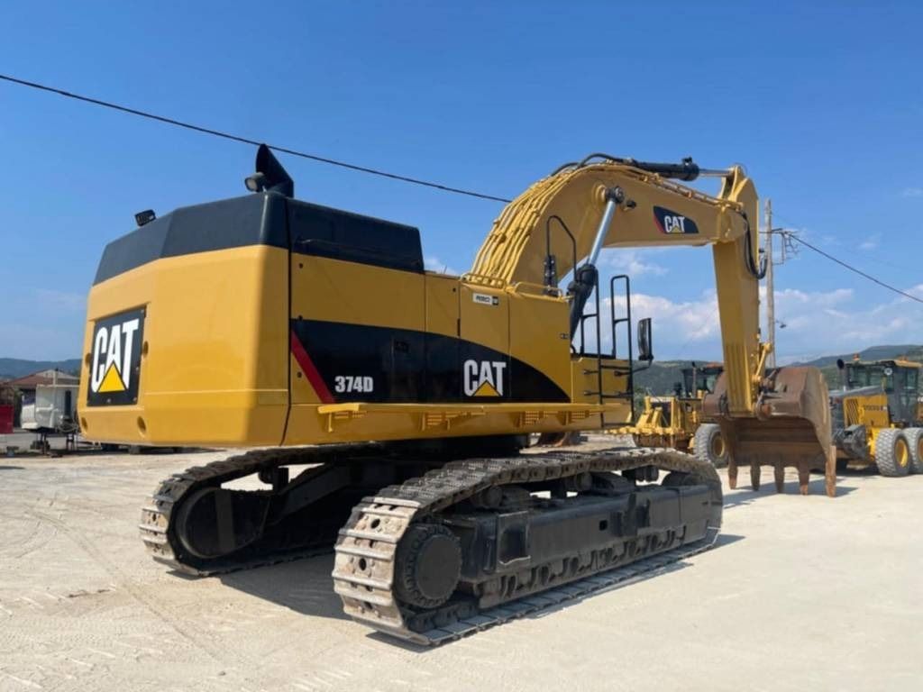 2012 Caterpillar 374D crawler excavator, rear three-quarter view 2012 Caterpillar 374D crawler excavator, rear three-quarter view