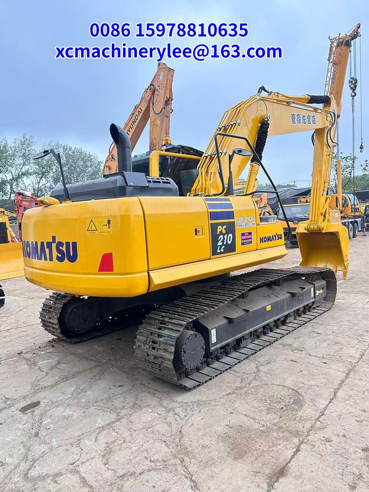 2024 Komatsu PC210LC crawler excavator, rear three-quarter view 2024 Komatsu PC210LC crawler excavator, rear three-quarter view