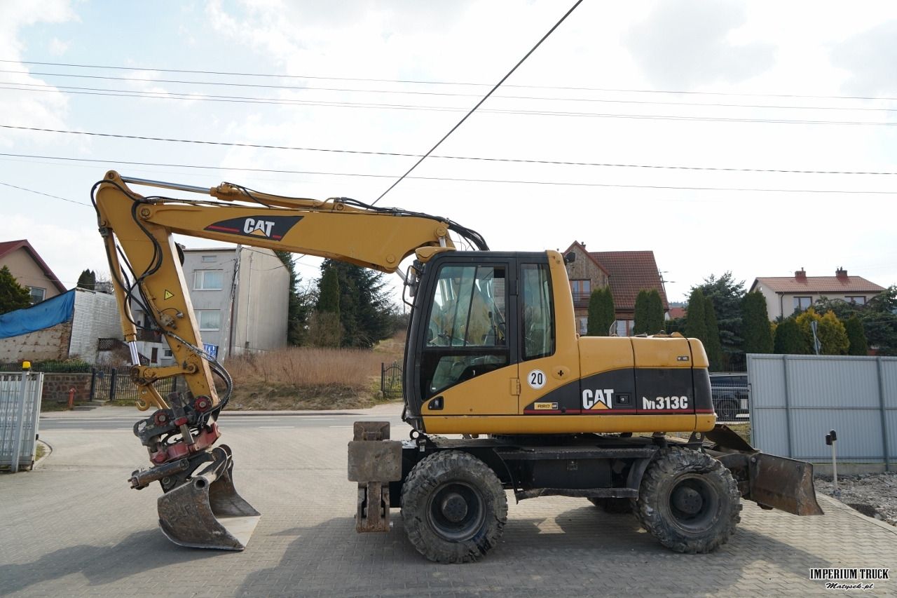 2003 Caterpillar M313C wheel excavator, side view 2003 Caterpillar M313C wheel excavator, side view