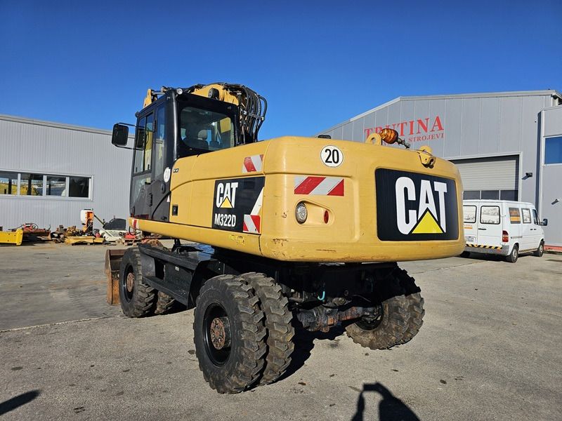 2011 Caterpillar M322D wheel excavator, rear three-quarter view 2011 Caterpillar M322D wheel excavator, rear three-quarter view