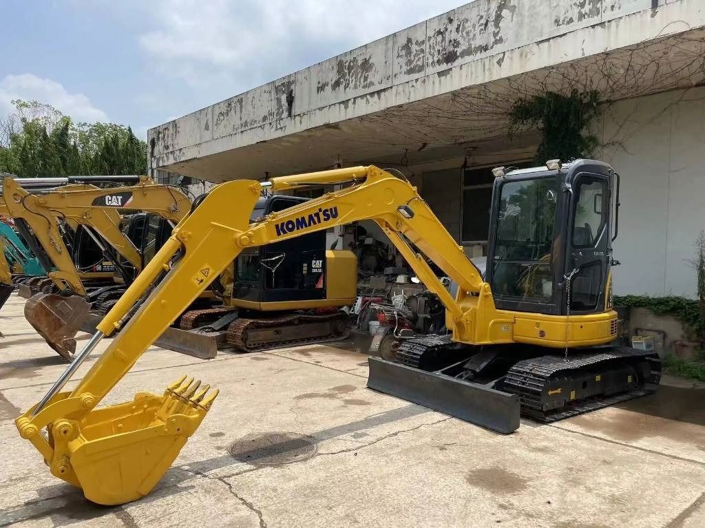 2022 Komatsu PC55MR-2 mini excavator, front three-quarter view 2022 Komatsu PC55MR-2 mini excavator, front three-quarter view