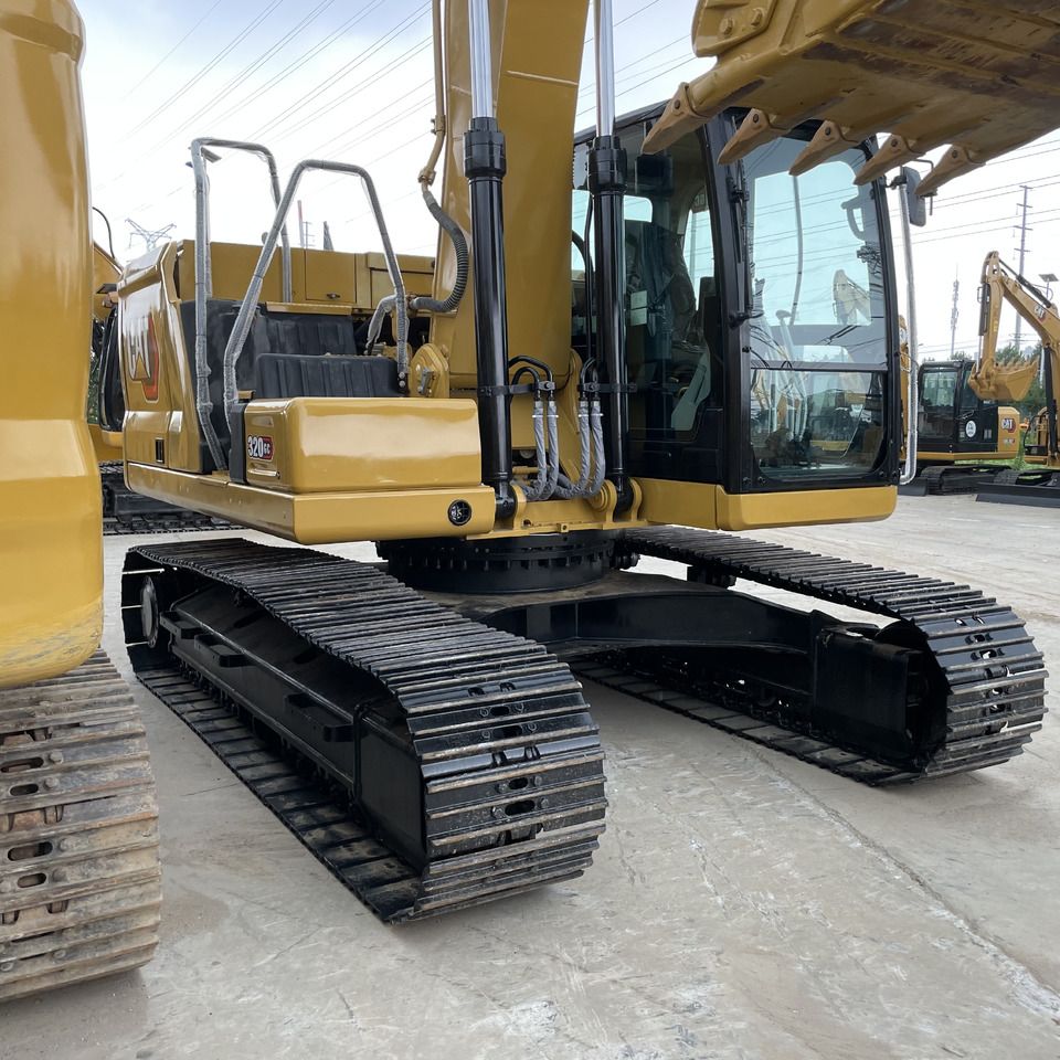 2024 Caterpillar 320GC crawler excavator, rear three-quarter view
