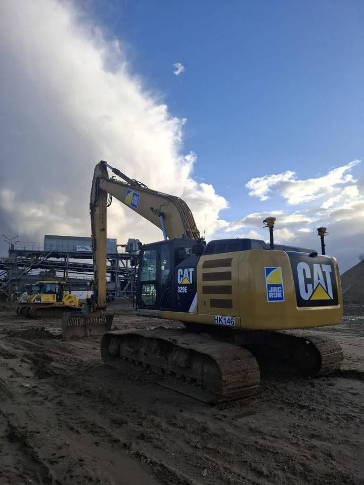 2013 Caterpillar 329E crawler excavator, rear three-quarter view 2013 Caterpillar 329E crawler excavator, rear three-quarter view
