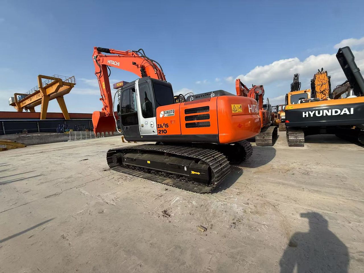 2022 Hitachi Zaxis 210 crawler excavator, rear three-quarter view 2022 Hitachi Zaxis 210 crawler excavator, rear three-quarter view