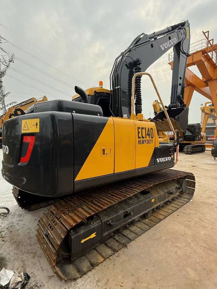 2025 Volvo EC140 crawler excavator, rear three-quarter view 2025 Volvo EC140 crawler excavator, rear three-quarter view
