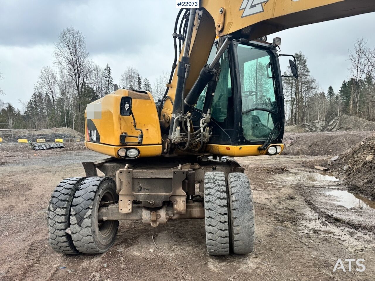 2011 Caterpillar M313D wheel excavator, front three-quarter view 2011 Caterpillar M313D wheel excavator, front three-quarter view