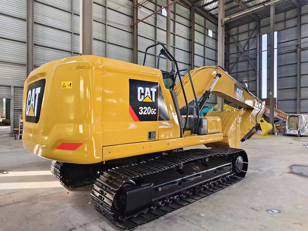2023 Caterpillar 320GC crawler excavator, rear three-quarter view 2023 Caterpillar 320GC crawler excavator, rear three-quarter view