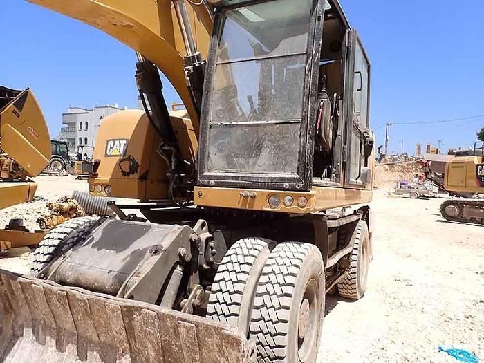 2016 Caterpillar M320F wheel excavator, front three-quarter view 2016 Caterpillar M320F wheel excavator, front three-quarter view