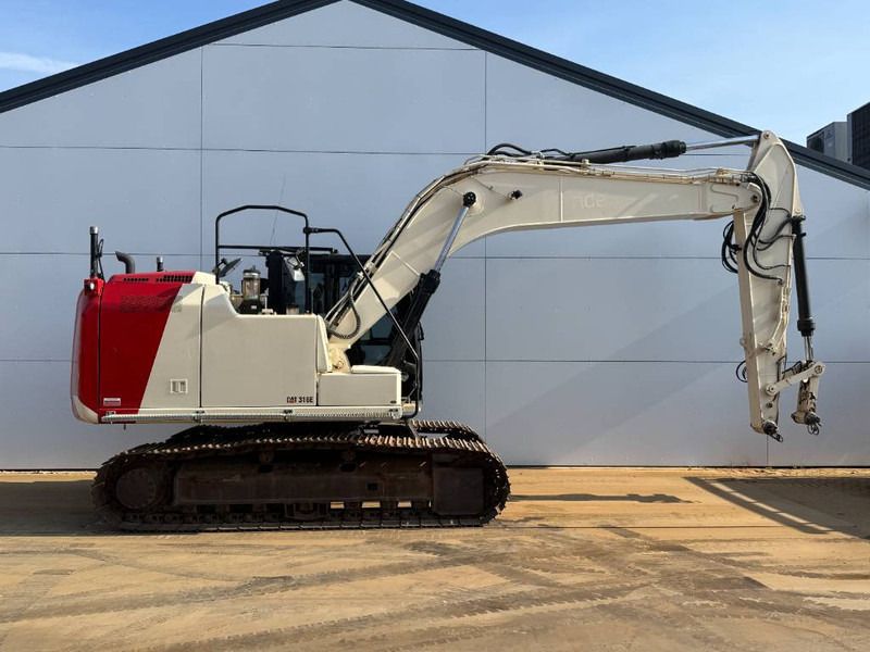 2012 Caterpillar 316EL crawler excavator, side view 2012 Caterpillar 316EL crawler excavator, side view