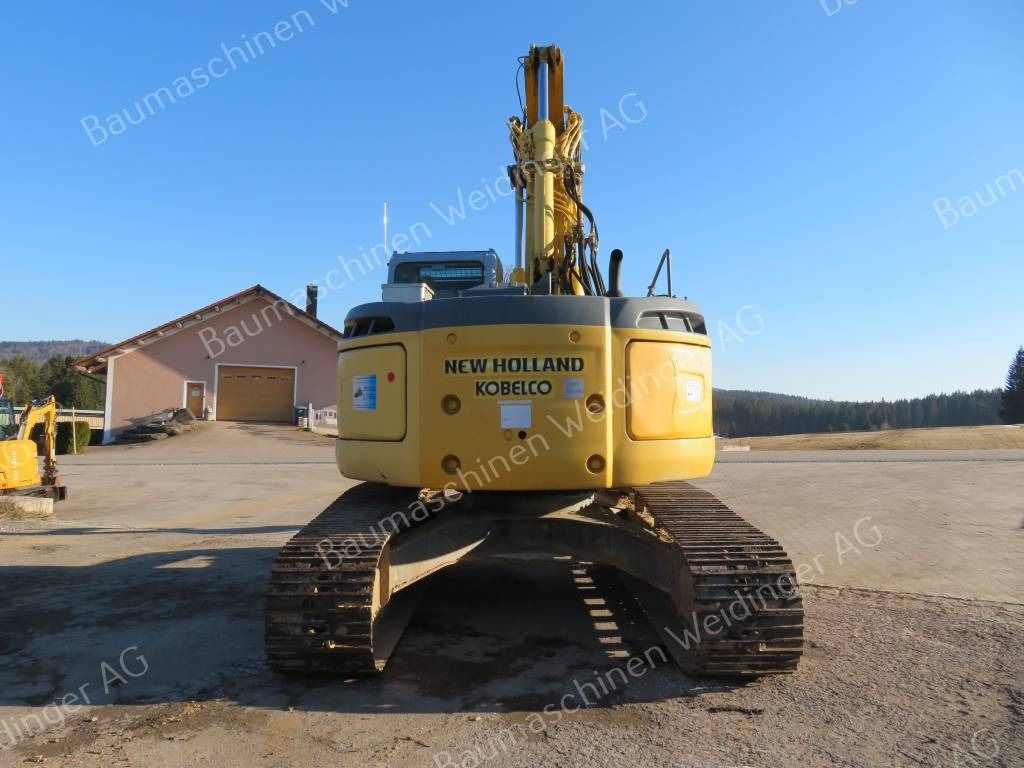 2009 New Holland E235BSR-2 ES crawler excavator rear view 2009 New Holland E235BSR-2 ES crawler excavator rear view