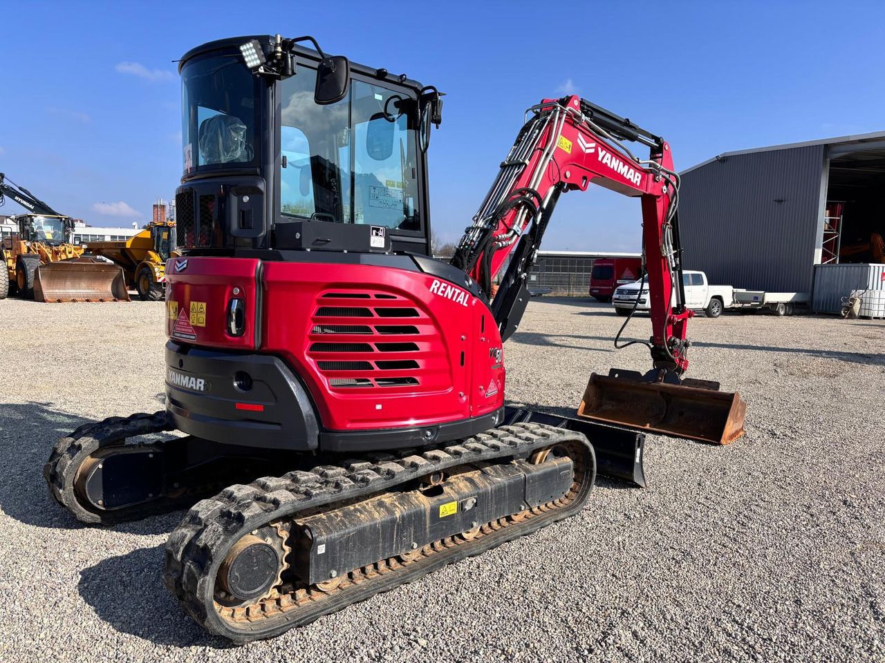 2023 Yanmar VIO50-6 mini excavator, rear three-quarter view 2023 Yanmar VIO50-6 mini excavator, rear three-quarter view