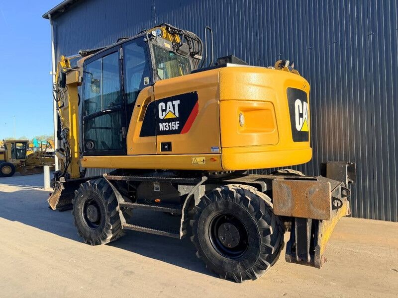 2017 Caterpillar M315F wheel excavator, rear three-quarter view 2017 Caterpillar M315F wheel excavator, rear three-quarter view