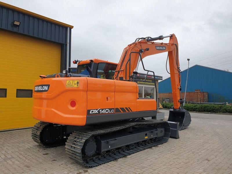 2023 Develon DX140LC crawler excavator, rear three-quarter view