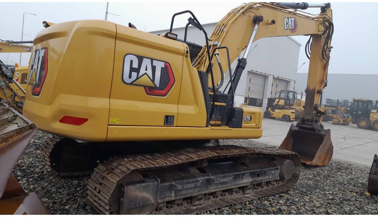 2021 Caterpillar 320-07 crawler excavator, rear three-quarter view