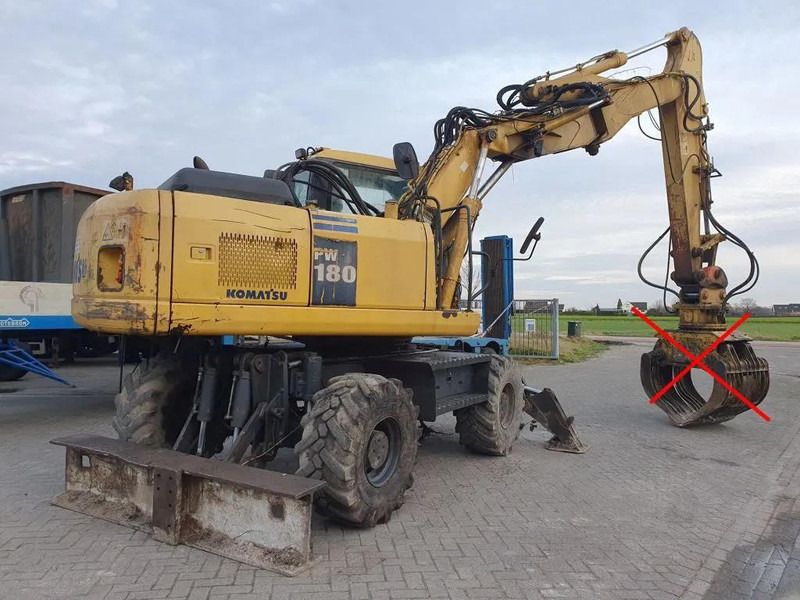 2006 Komatsu PW180-7K wheel excavator, rear three-quarter view 2006 Komatsu PW180-7K wheel excavator, rear three-quarter view
