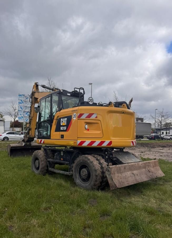 2020 Caterpillar M315F wheel excavator, rear three-quarter view