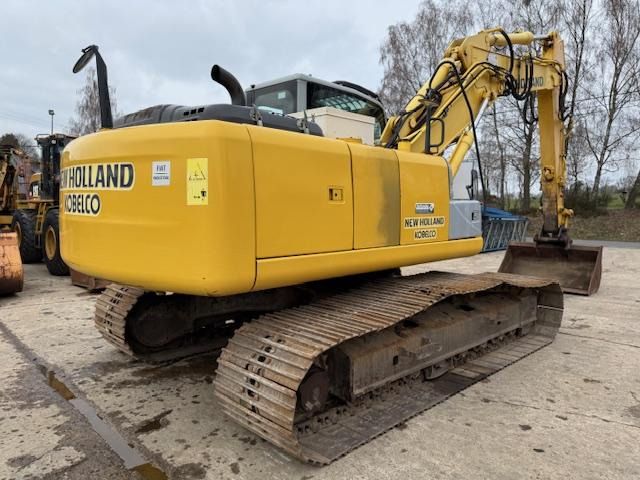 2011 New Holland Kobelco E215B crawler excavator rear three-quarter view 2011 New Holland Kobelco E215B crawler excavator rear three-quarter view