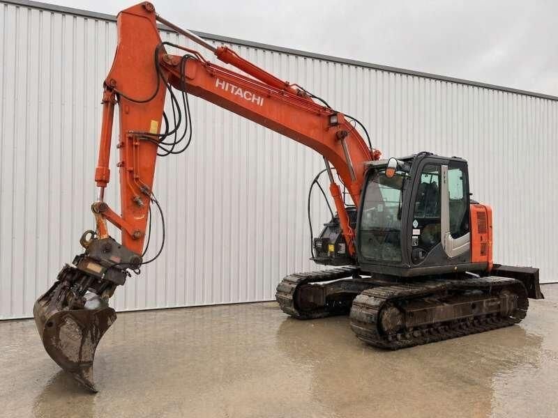 2010 Hitachi ZX135US-3 crawler excavator, side view 2010 Hitachi ZX135US-3 crawler excavator, side view
