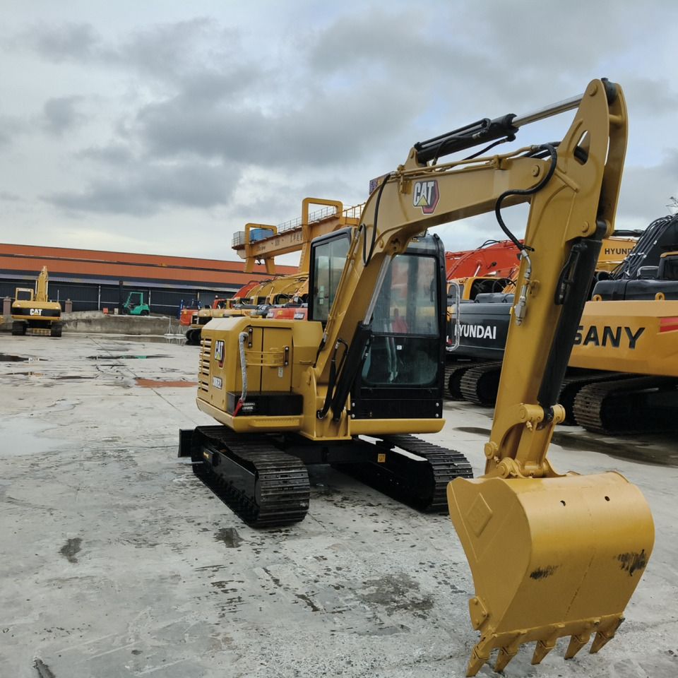 2023 Caterpillar 306E2 mini excavator, three-quarter view 2023 Caterpillar 306E2 mini excavator, three-quarter view