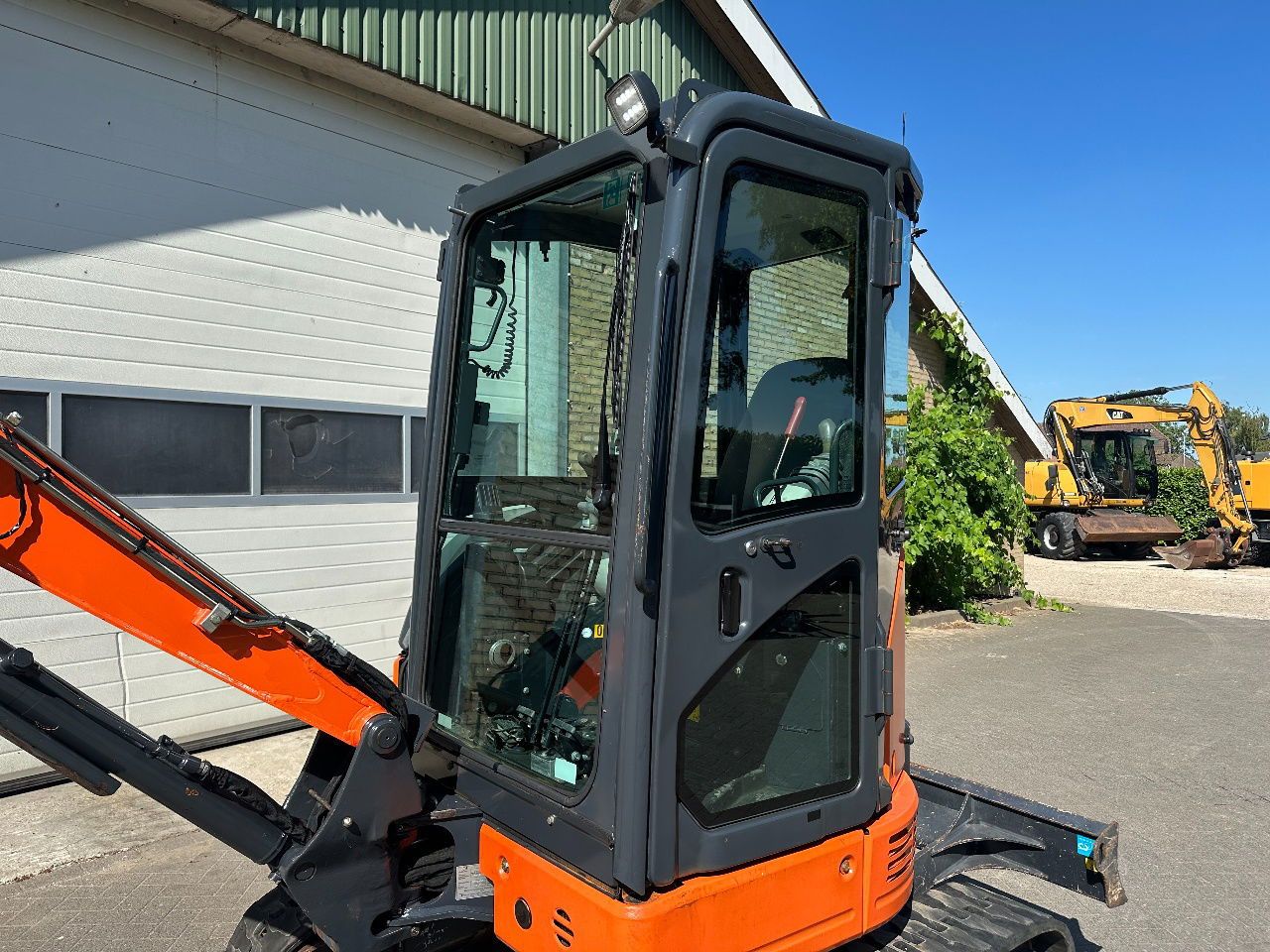 Hitachi ZX26U-6CR mini excavator cab side view Hitachi ZX26U-6CR mini excavator cab side view