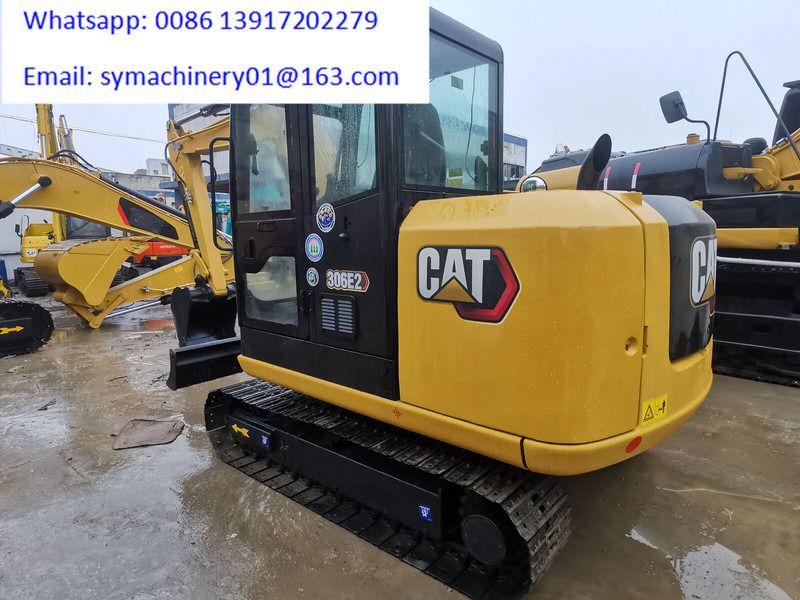 2023 Caterpillar 306E2 mini excavator, rear three-quarter view 2023 Caterpillar 306E2 mini excavator, rear three-quarter view