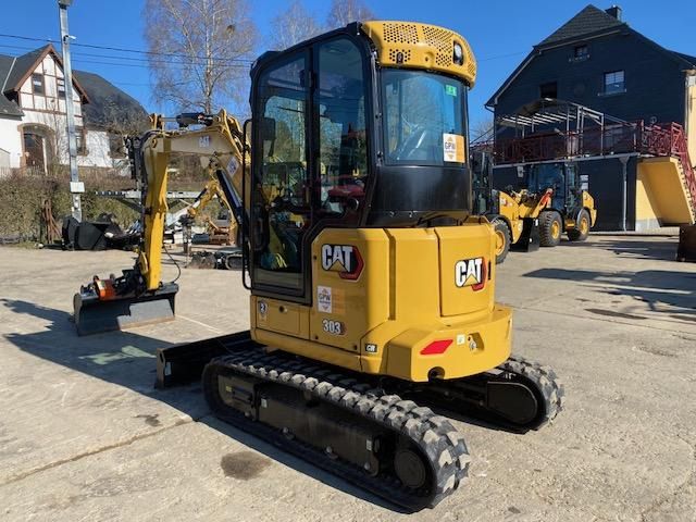 2023 Caterpillar 303CR mini excavator, rear three-quarter view 2023 Caterpillar 303CR mini excavator, rear three-quarter view