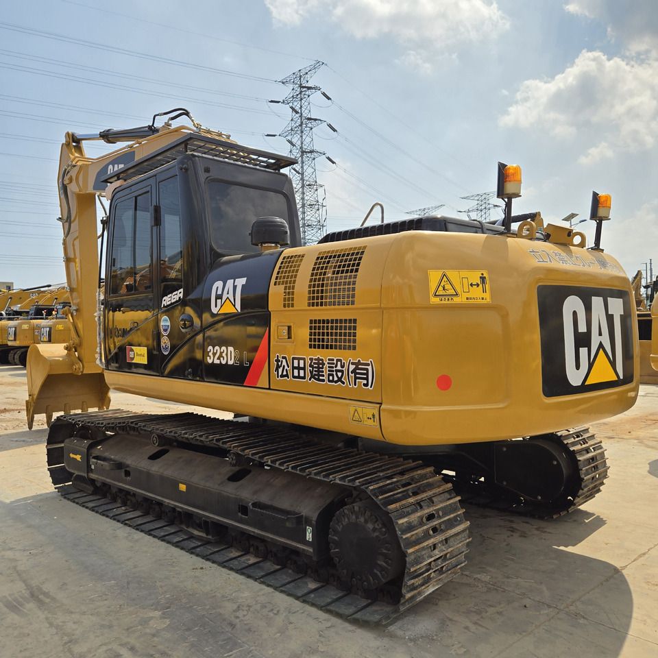 2023 Caterpillar 323D2L crawler excavator, rear three-quarter view