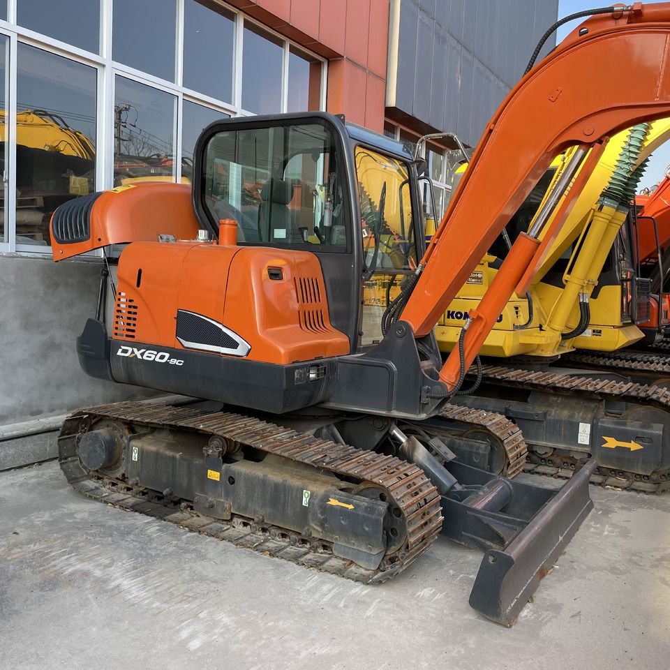 Doosan DX60-9C mini excavator, side view
