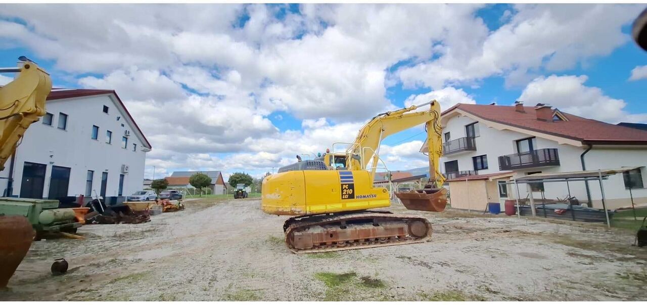 Komatsu PC210LC-10 crawler excavator, rear three-quarter view