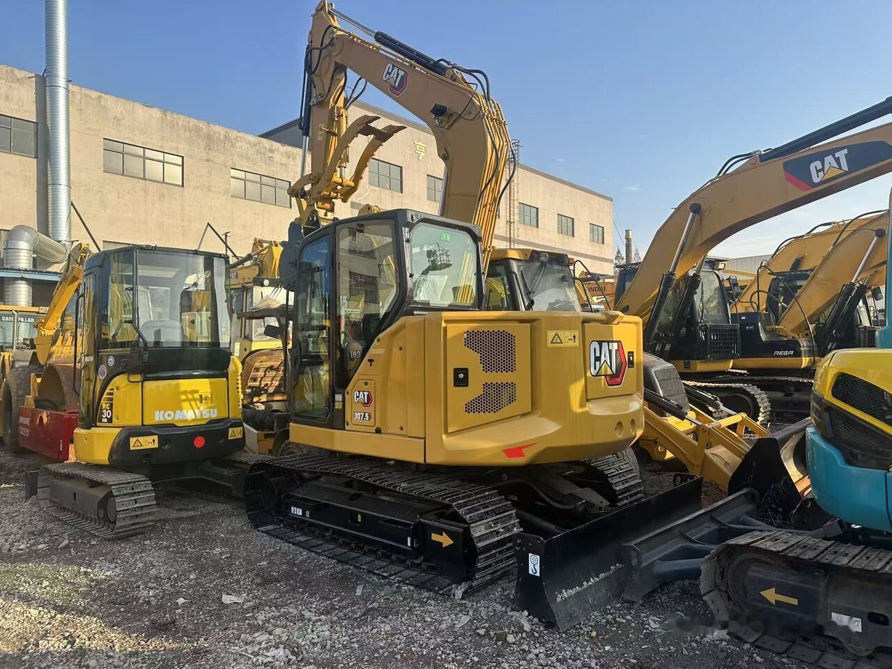 Caterpillar 307.5 crawler excavator, rear three-quarter view Caterpillar 307.5 crawler excavator, rear three-quarter view