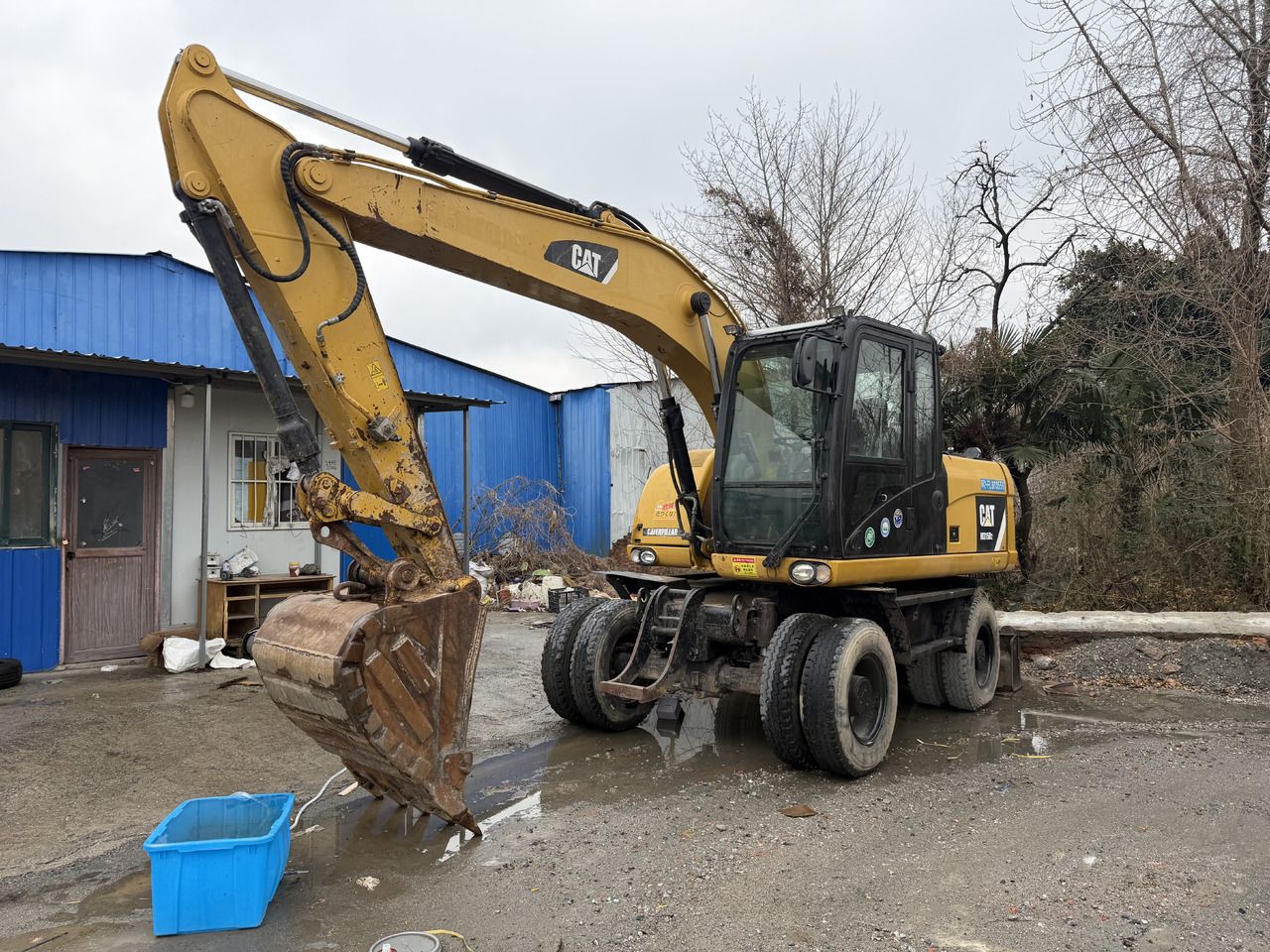2018 Caterpillar M312D2 wheel excavator, front three-quarter view 2018 Caterpillar M312D2 wheel excavator, front three-quarter view