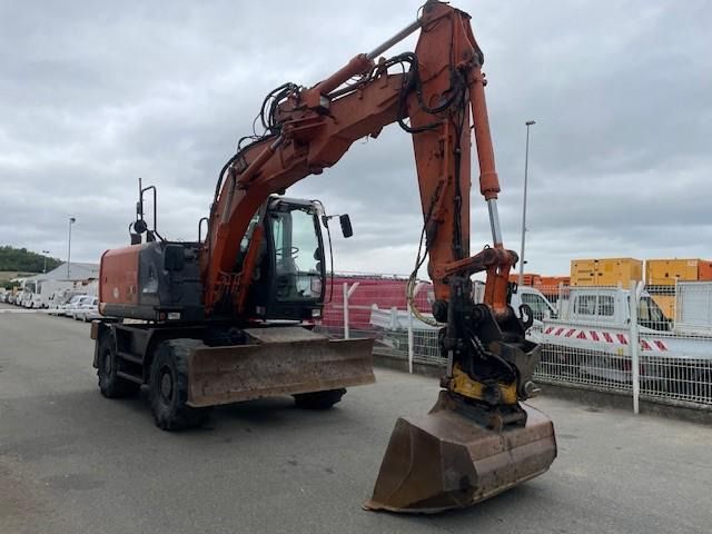 2014 Hitachi ZX140W-5 wheel excavator, front three-quarter view 2014 Hitachi ZX140W-5 wheel excavator, front three-quarter view