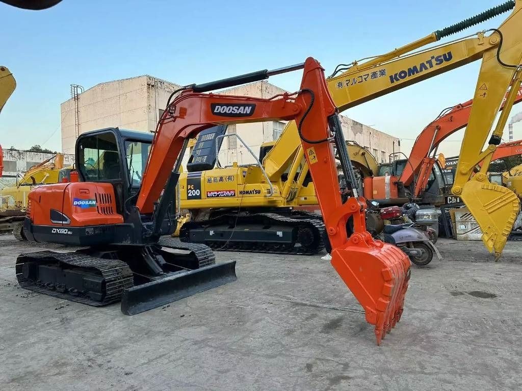 2022 Doosan DX60-9C mini excavator, side view 2022 Doosan DX60-9C mini excavator, side view