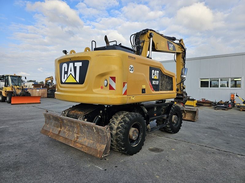 2016 Caterpillar M318F wheel excavator, rear three-quarter view 2016 Caterpillar M318F wheel excavator, rear three-quarter view