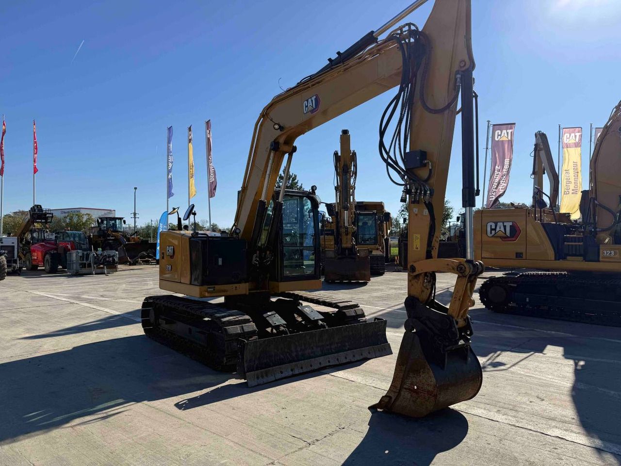 2022 Caterpillar 310 crawler excavator, side view