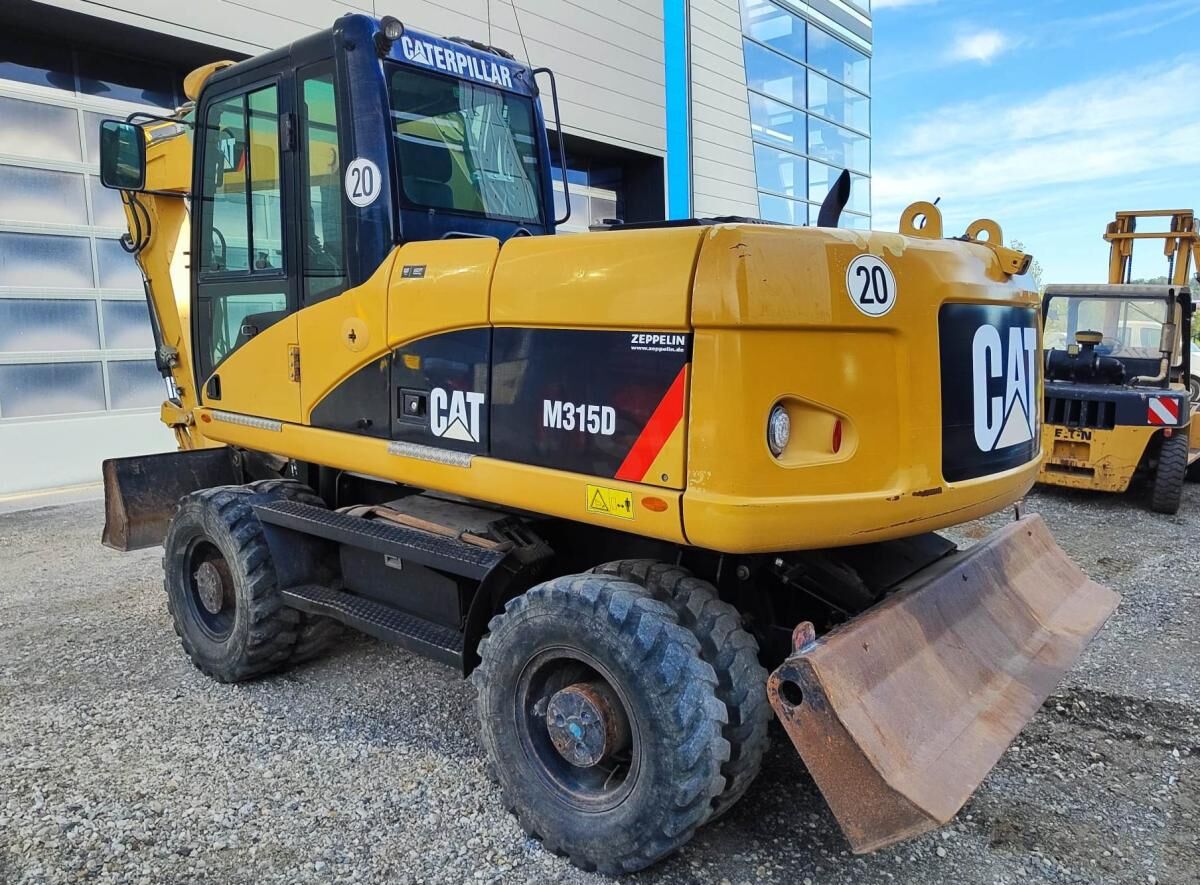2009 Caterpillar M315D wheel excavator, rear three-quarter view