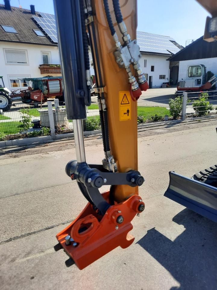 Kubota XE27E mini excavator boom and quick coupler detail Kubota XE27E mini excavator boom and quick coupler detail