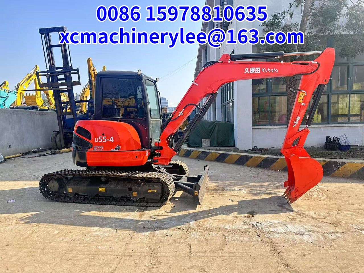2023 Kubota U55-4 mini excavator side view 2023 Kubota U55-4 mini excavator side view