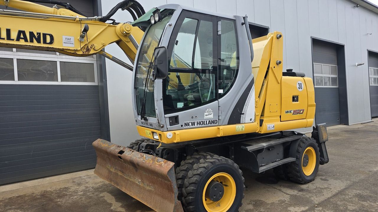 2011 New Holland WE150C wheel excavator, front three-quarter view 2011 New Holland WE150C wheel excavator, front three-quarter view