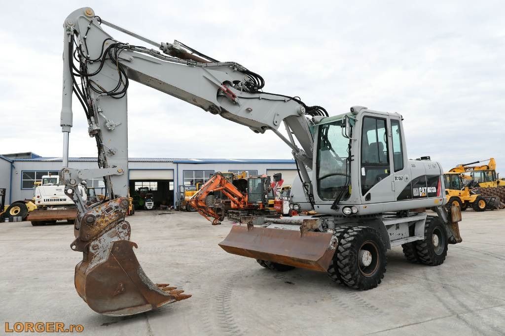 2009 Caterpillar M313D wheel excavator side view 2009 Caterpillar M313D wheel excavator side view