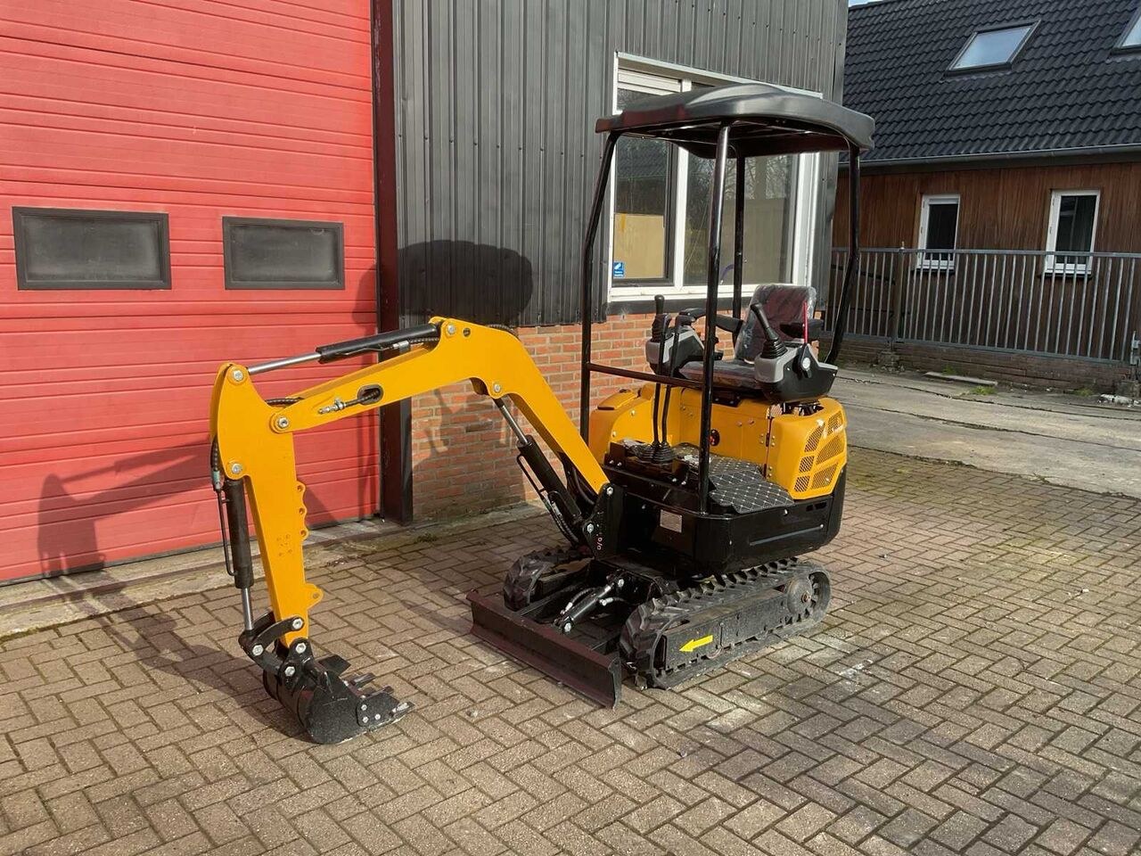 JPC KV15 mini excavator, three-quarter front view