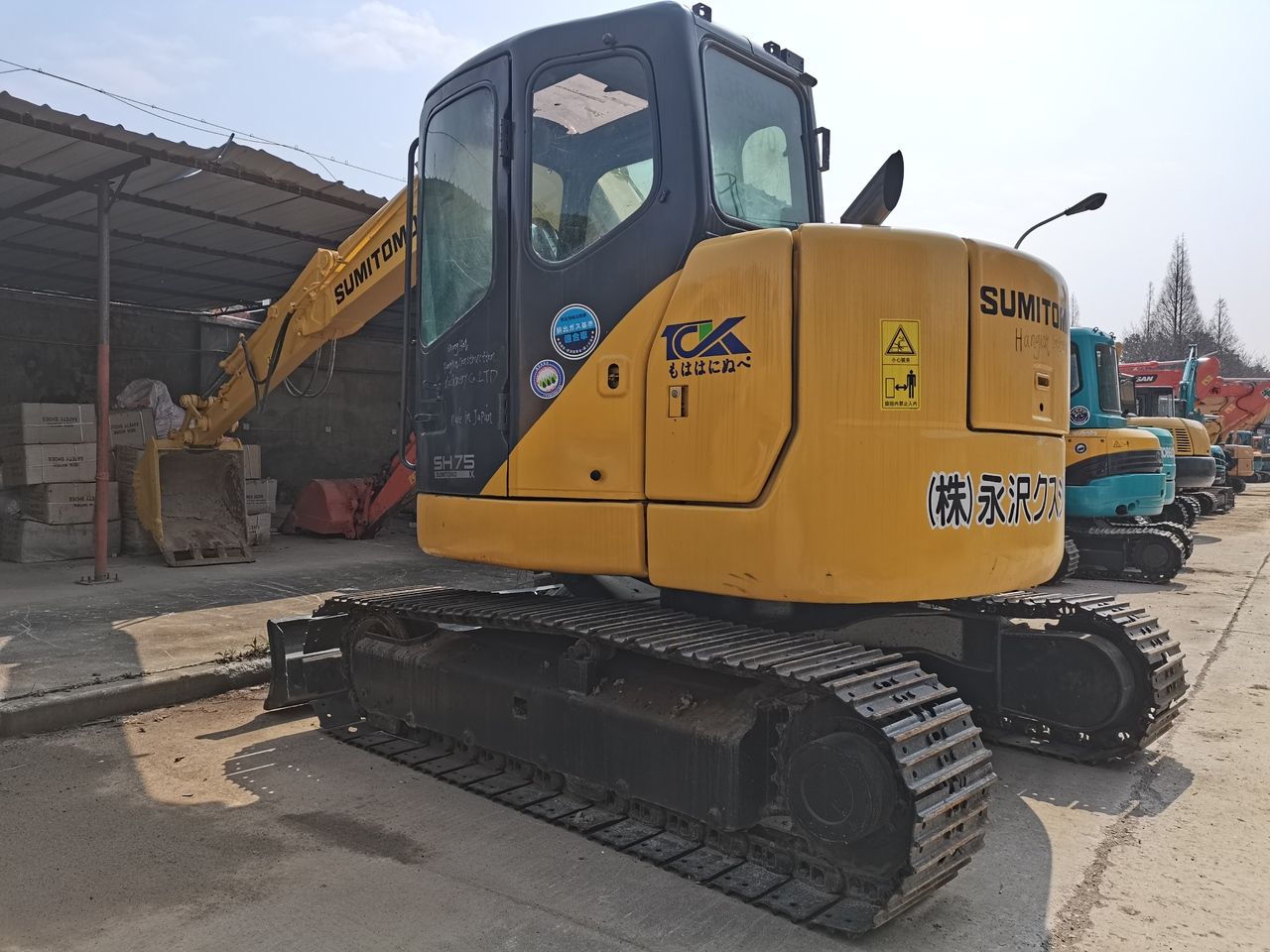 2016 Sumitomo SH75 mini excavator, rear three-quarter view 2016 Sumitomo SH75 mini excavator, rear three-quarter view