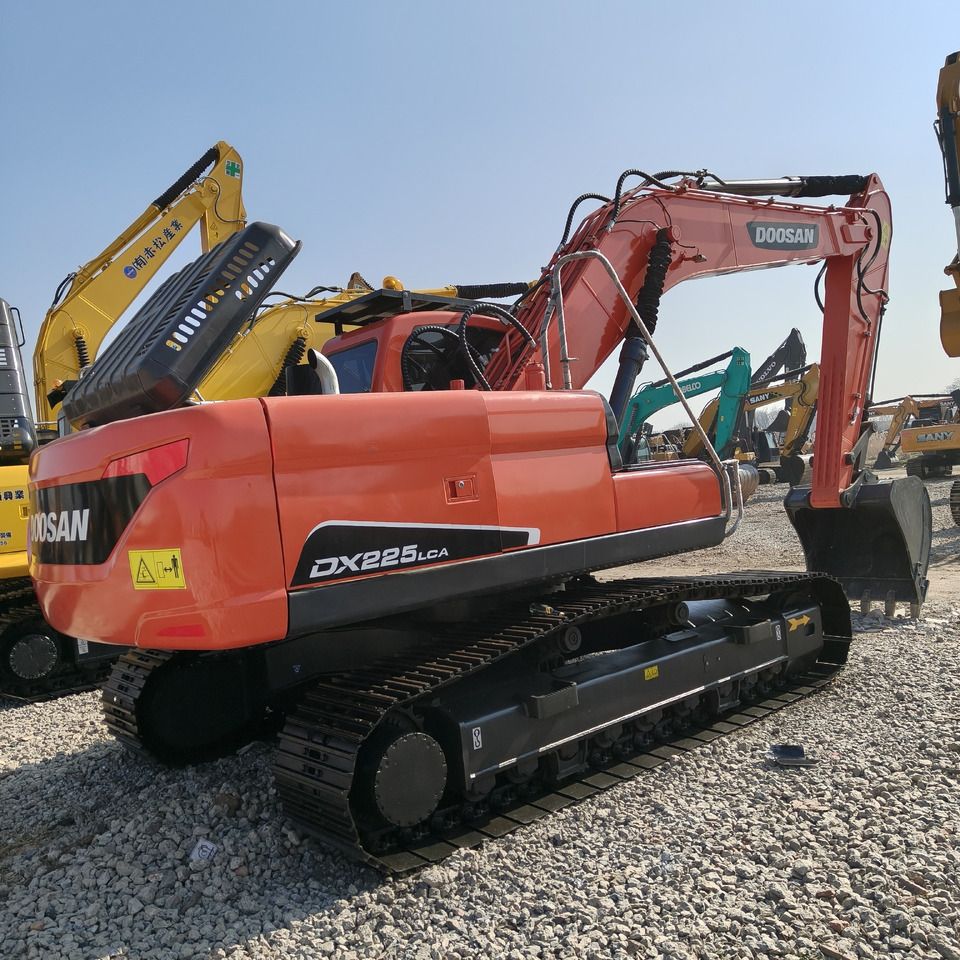 2024 Doosan DX225LCA crawler excavator, rear three-quarter view