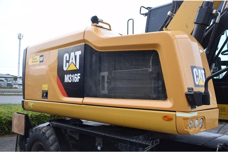 2018 Caterpillar M316F wheel excavator engine compartment side view 2018 Caterpillar M316F wheel excavator engine compartment side view