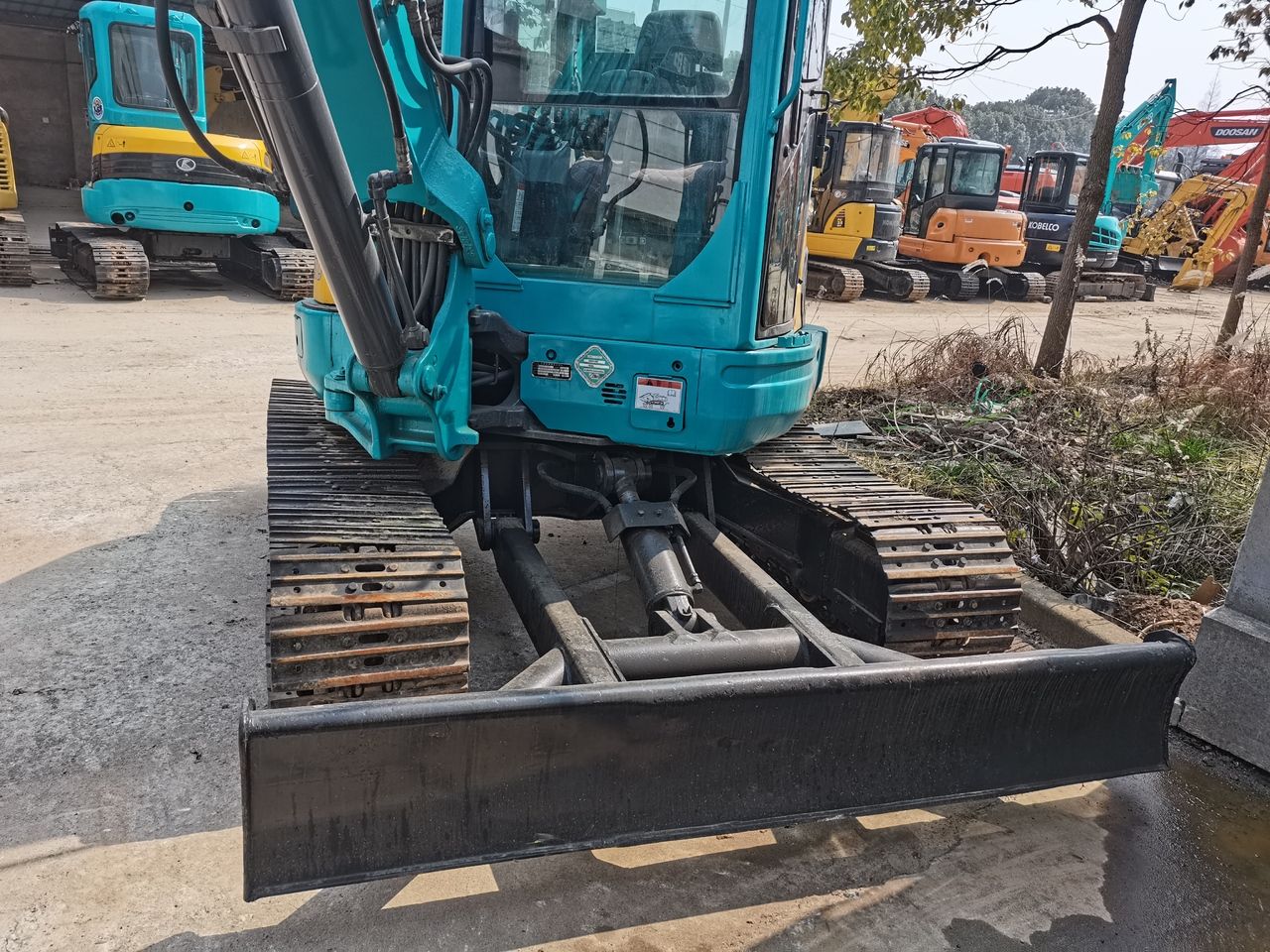 2016 Kubota KX155 mini excavator front view with blade